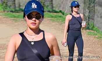 Lucy Hale shows off her toned figure in black tank top and gym leggings as she steps out for a hike