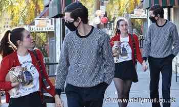 Scout Willis looks twee in a vintage red cardigan as she steps out with her beau Jake Miller in LA