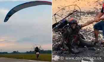 Moment paraglider faceplants in a muddy paddy field when take-off goes wrong in Thailand [Video]