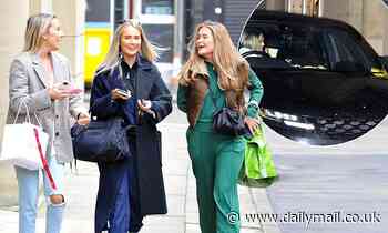Molly-Mae Hague laughs with her friends out shopping in Manchester before getting a parking ticket