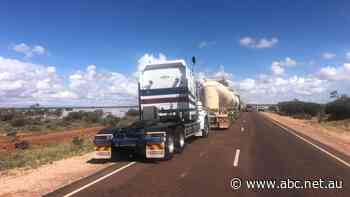 Stay or go? Blocked by floods in SA, truckies weigh 'big tour' option to get fresh food to NT
