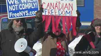 Dozens gather near Rainbow Bridge to protest vaccine mandate on truckers crossing into Canada