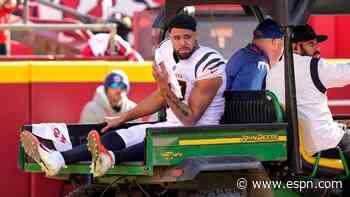 Bengals TE Uzomah carted off with knee injury