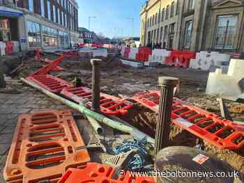 Storm Malik throws Bolton Town Centre road work barriers - The Bolton News