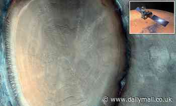 Crater on Mars looks just like a tree stump with concentric rings 