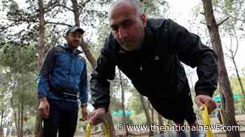 A visually impaired marathon runner trains in Jordan - in pictures - The National