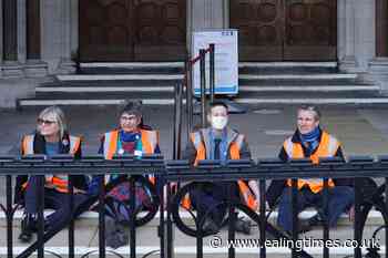 Insulate Britain protesters in custody after gluing themselves to court steps - Ealing Times