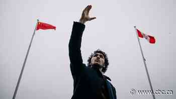 Uyghur activist urges Olympians to put pressure on China with podium gesture