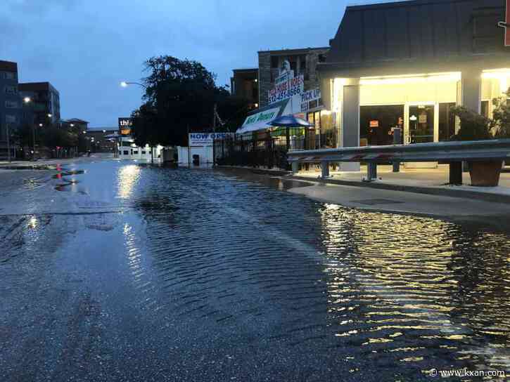 Water flowing down streets after main break in central Austin