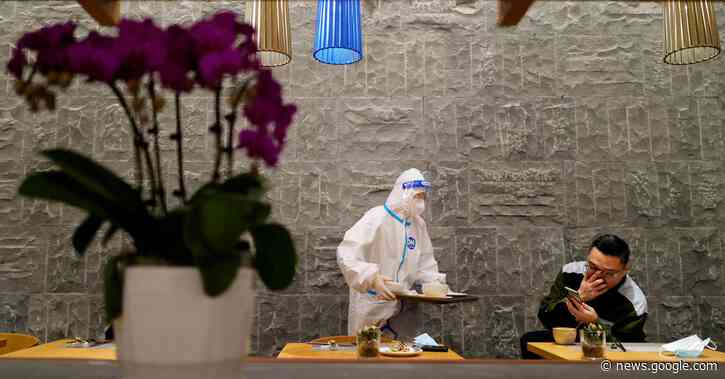 Cocktails and hazmat suits mingle in the Beijing Olympics bubble - Reuters