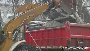 WNYers spend day clearing out snow as more continues to fall