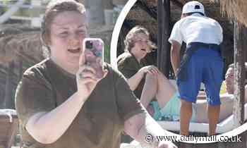 Lena Dunham gets tactile with husband Luis Feller on Mexican getaway - Daily Mail