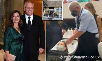 Scott Morrison wearing an apron massages a woman's head at a Melbourne salon - Daily Mail