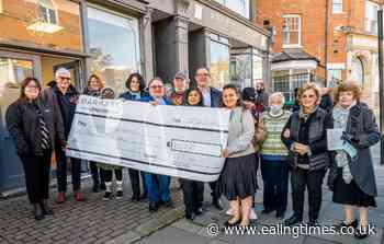 Acton charity handed £10,000 donation by developer