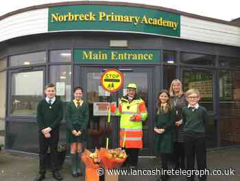 Lancashire lollipop lady celebrates 40 years helping children cross the road