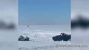 Coast Guard conducts 'mass rescue' of stranded snowmobilers after ice breaks on Lake Erie
