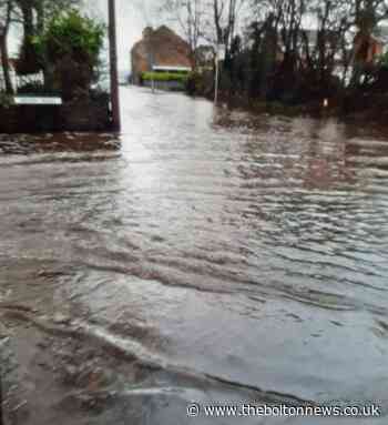Flood alerts for parts of Bolton as Harwood road hit by flooding - The Bolton News