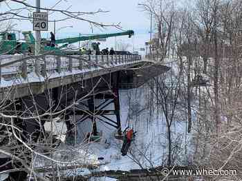 Snowmobiles being removed from the Erie Canal