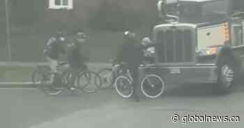 Truck driver fired after appearing to brush cyclist at Vancouver convoy protest