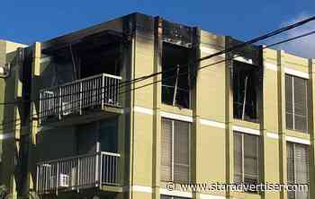 Suspect held after body found in burned-out apartment