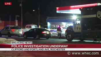 Early morning police scene at gas station on Rochester north side
