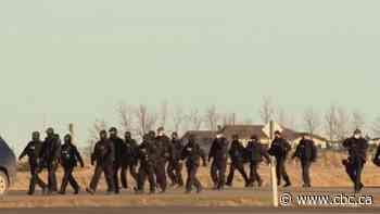 Protesters at Alberta border crossing decline to move to new site as RCMP issue tickets