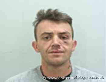 Thug who assaulted police on run from prison