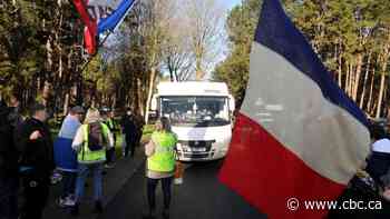 Galvanized by Canadian trucker protests, convoy of vehicles descends on French capital