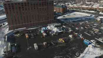 Protesters have taken over ex-Winnipeg mayor Sam Katz's Ottawa ballpark parking lot - CBC.ca