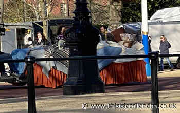 Harry Styles spotted filming in large bed in front of Buckingham Palace