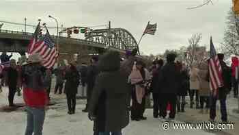 People gather at the Peace Bridge to protest COVID-19 mandates on border travel