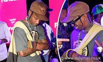 Travis Scott keeps his head down as he attends Michael Rubin's Super Bowl party in Los Angeles - Daily Mail
