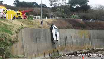 Car falls 40 feet over beach wall in Sutton, Co Dublin - Independent.ie