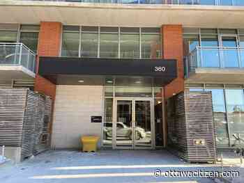 McLeod Street condo residents rattled after men seen attempting to 'handcuff' lobby doors