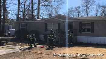 Two people injured after trailer home fire in Suffolk