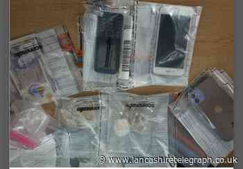 Two arrested in Colne after class A drugs, cash and phones seized from house