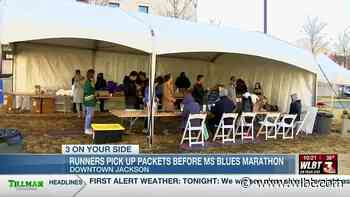 Runners pick up packets before Mississippi Blues Marathon - WLBT