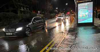 Burst water main sees torrent pour down Sutton Coldfield road - Birmingham Live