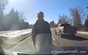 WATCH: Aurora Man Beats Car Right In The Middle Of Traffic - New Country 99.1