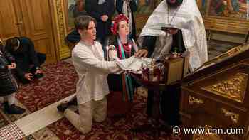 Air raid sirens instead of church bells. Couple weds as Russia invades