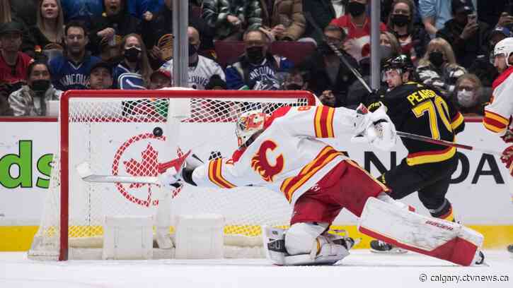 Miller puts up 4 points, Canucks snap Flames' 10-game win streak with lopsided win