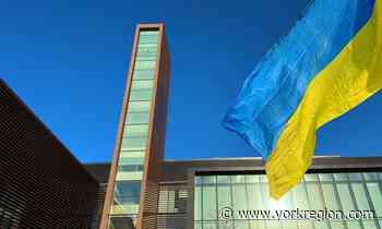 Vaughan raises Ukrainian flag, illuminates city hall with yellow, blue to show solidarity - yorkregion.com