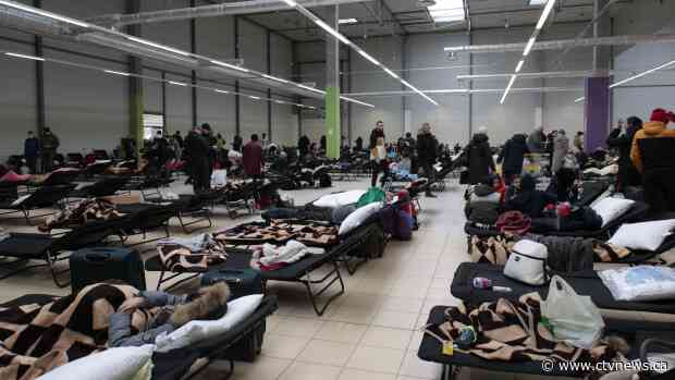 Displaced by war, tens of thousands of Ukrainians take shelter in Poland
