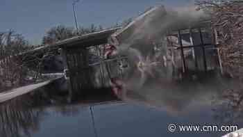 See tractor-trailer plunge off bridge into icy river