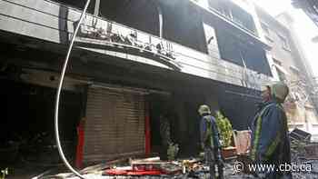 At least 11 killed in Syria shopping mall fire, says state media