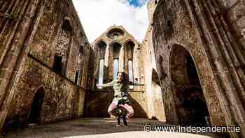 DJ Steve Aoki takes trademark #aokijump pic at the Rock of Cashel - Independent.ie