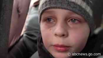 WATCH:  Heartbreaking moment boy says he left his father in Kyiv