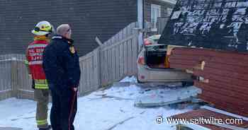 UPDATED: Car crashes through Mount Pearl shed and into house, driver trapped inside - Saltwire