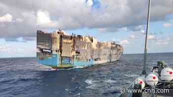 Burnt-out cargo ship carrying thousands of luxury cars sinks