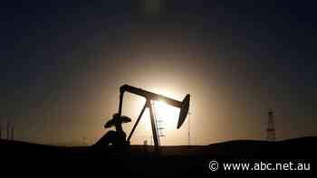 Oil hits an eight-year high, while Wall Street rises on Powell's rate hike talk